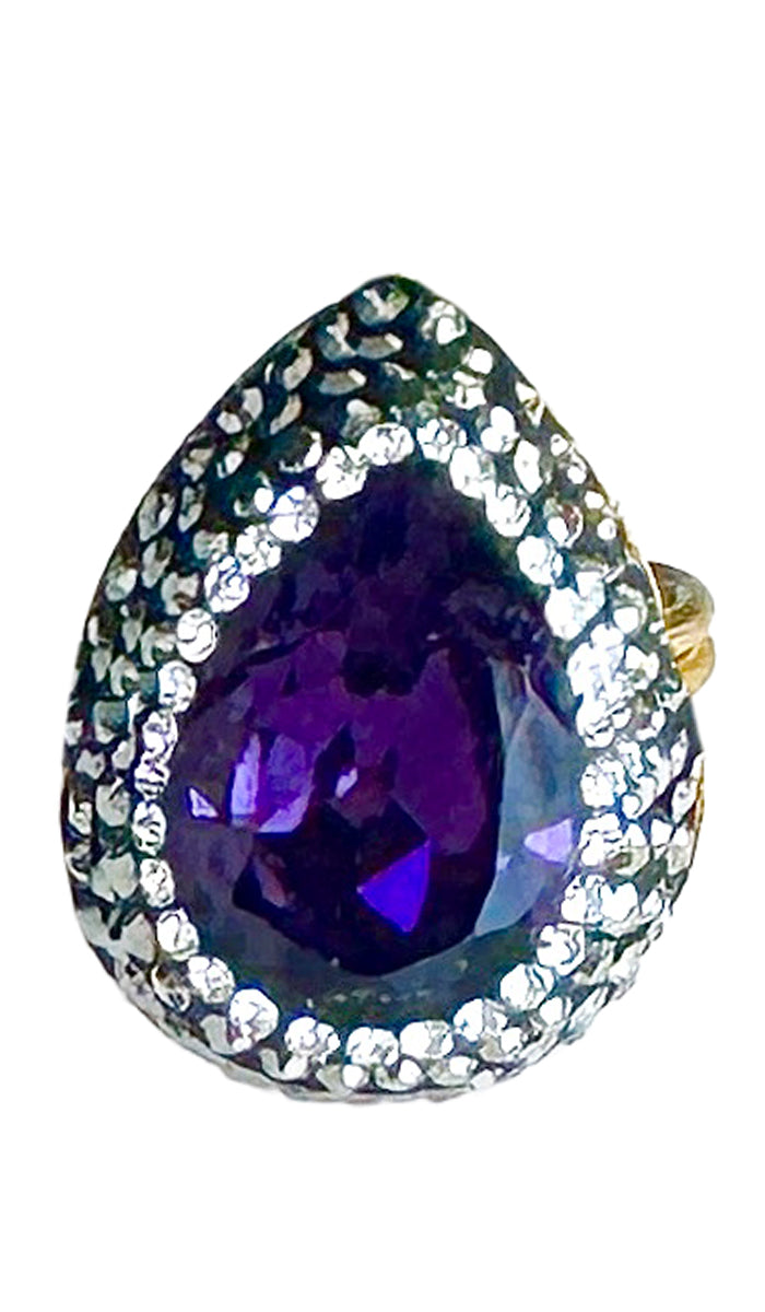 Teardrop ring with purple jewel and CZ crystals.