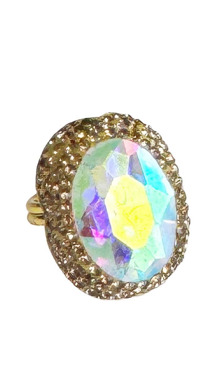 iridescent oval ring with gold shimmer crystals.