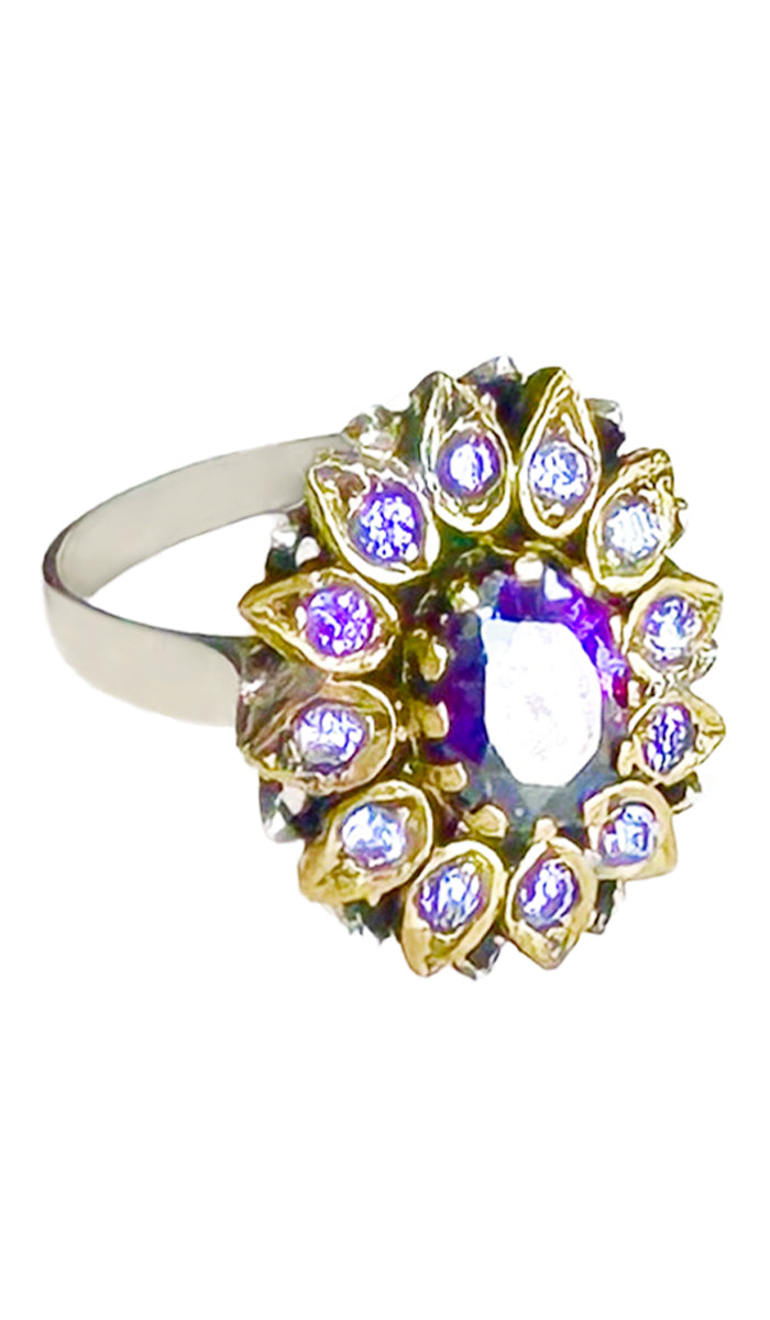 Side views of purple jeweled ring with purple crystals.