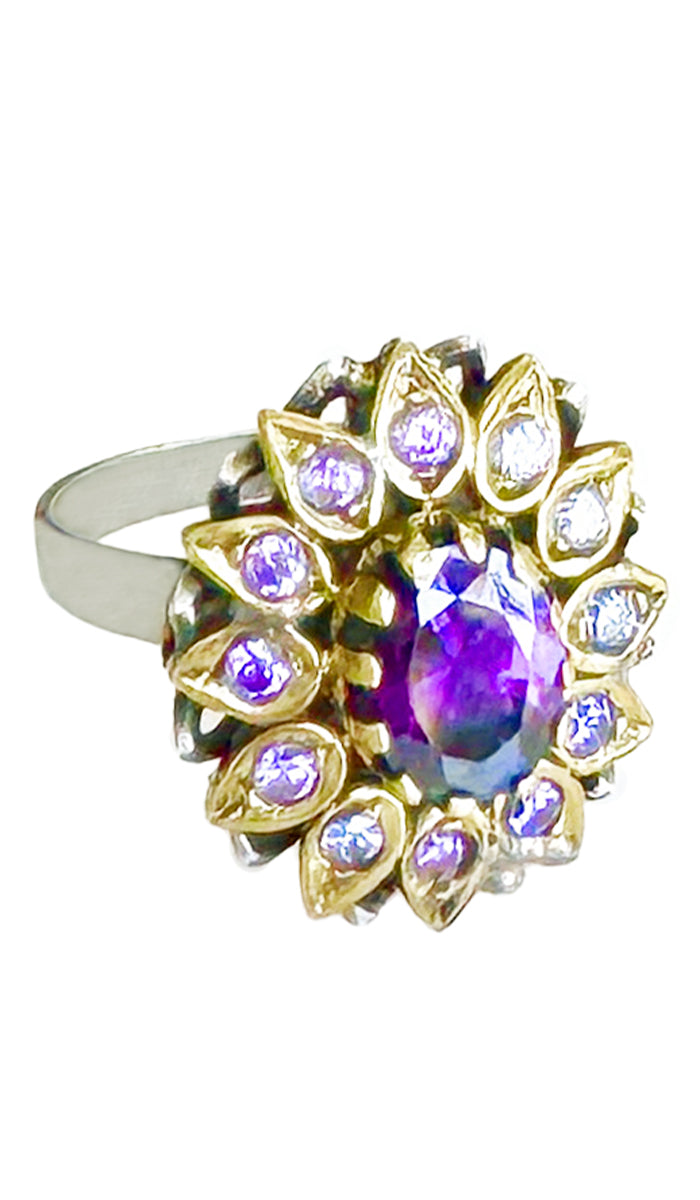 Purple jeweled ring with purple crystals.