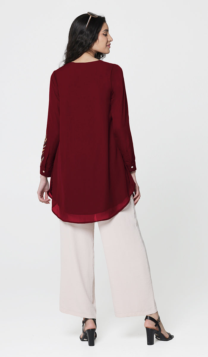 Back view of Baraka tunic in Ruby. 