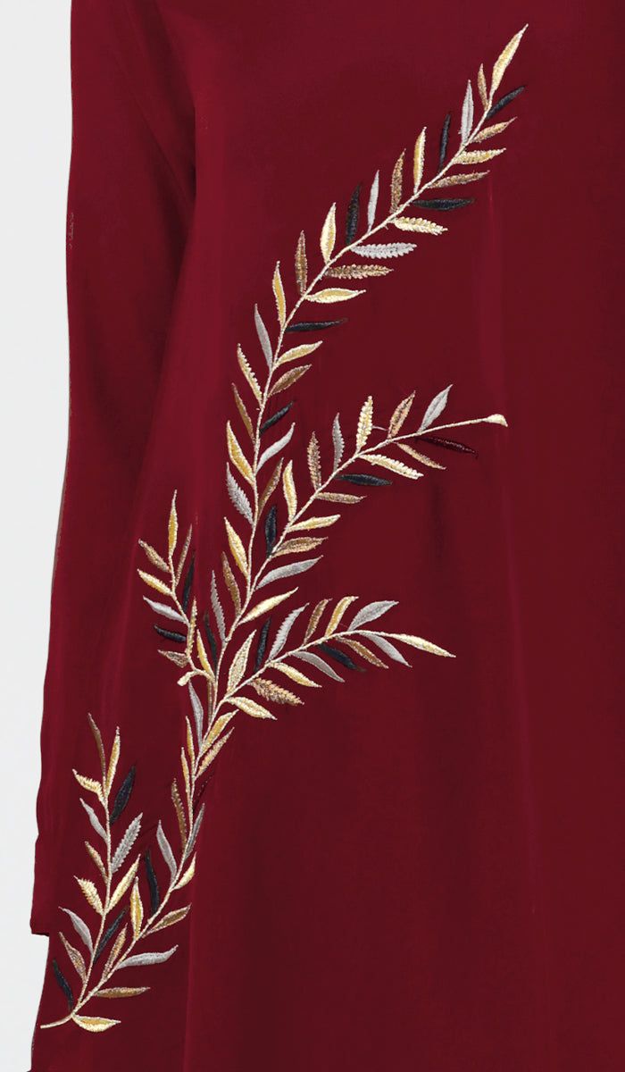 Embroidery details of Baraka tunic in Ruby. 