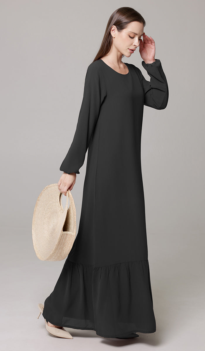 Woman wearing Batool dress in Black. 