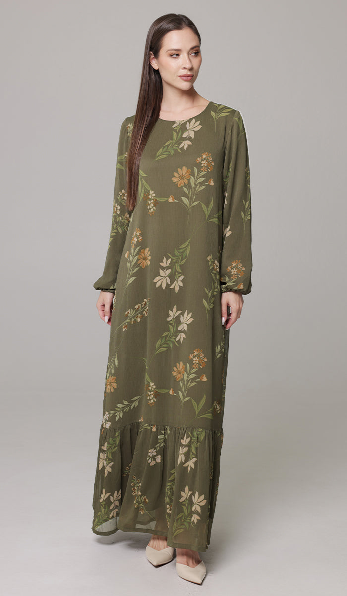 Woman looking to the side wearing Batool dress in Olive. 