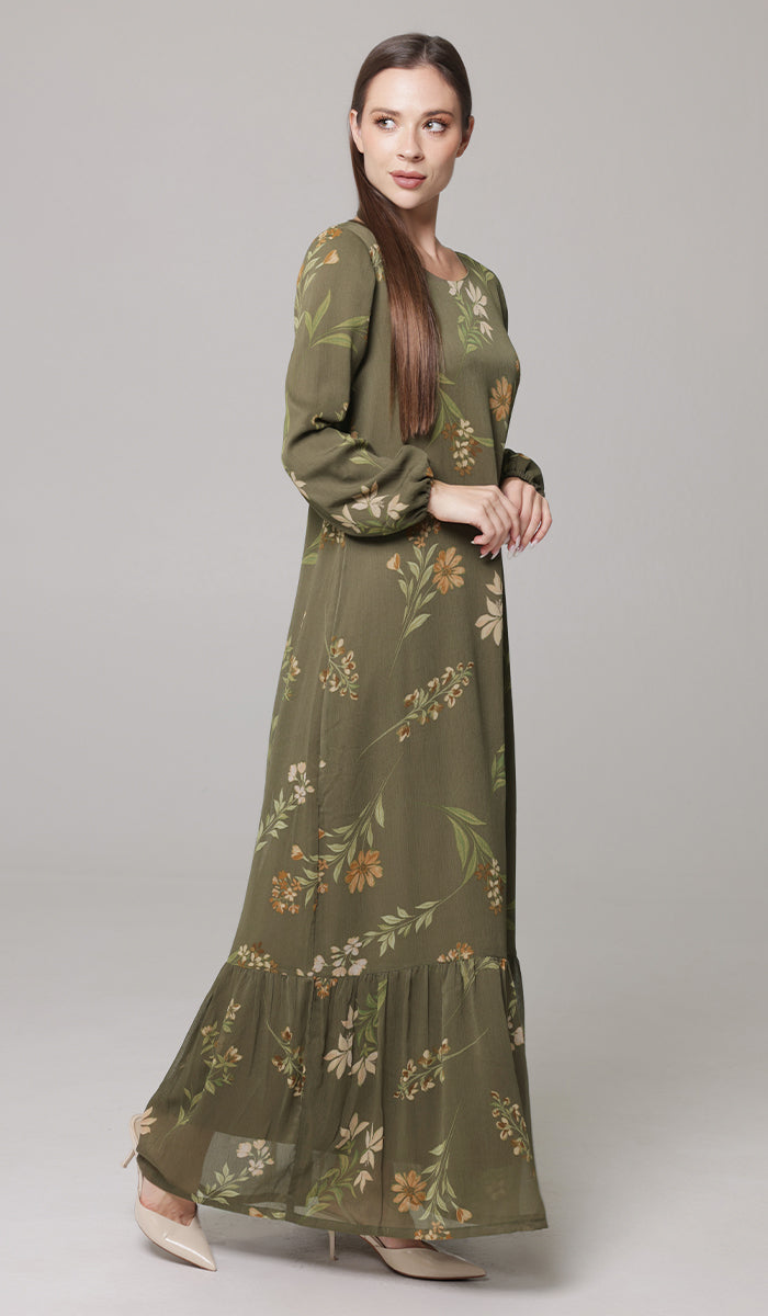 Side view of brunette woman wearing Batool maxi dress in Olive. 