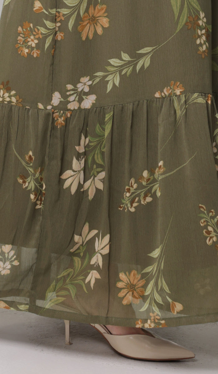 Details of bottom of Batool dress in Olive. 