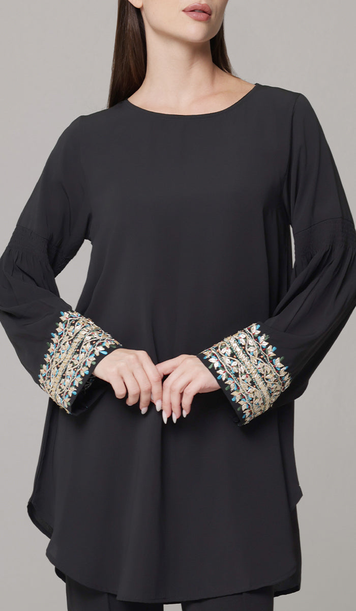 Woman wearing Esme modest tunic in Black. 