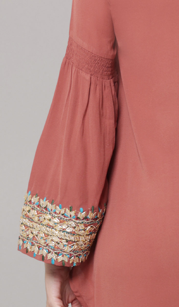 Close up of embroidery details of Esme tunic in Rose. 