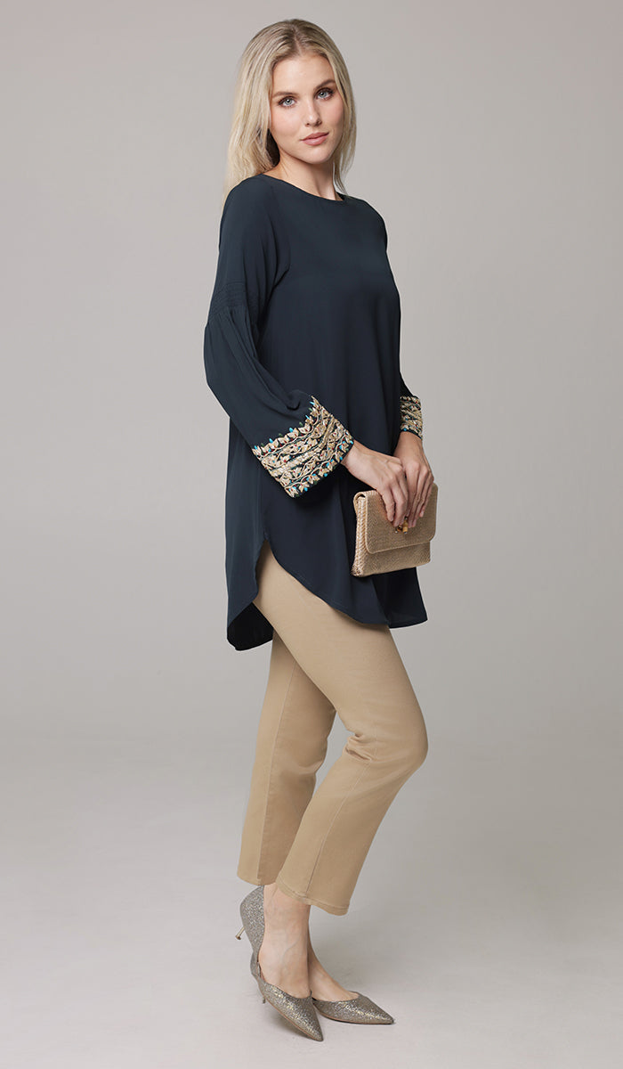 Woman wearing modest Esme tunic in Dark Teal with Erem pants and heels. 