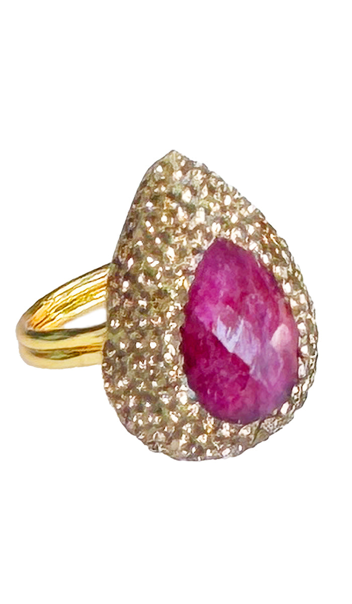 side view of tear dropped pink ruby ring.