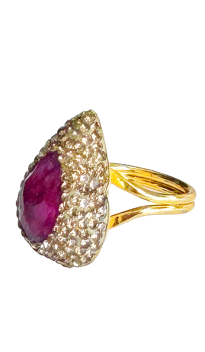 side profile view of tear dropped pink ruby ring.