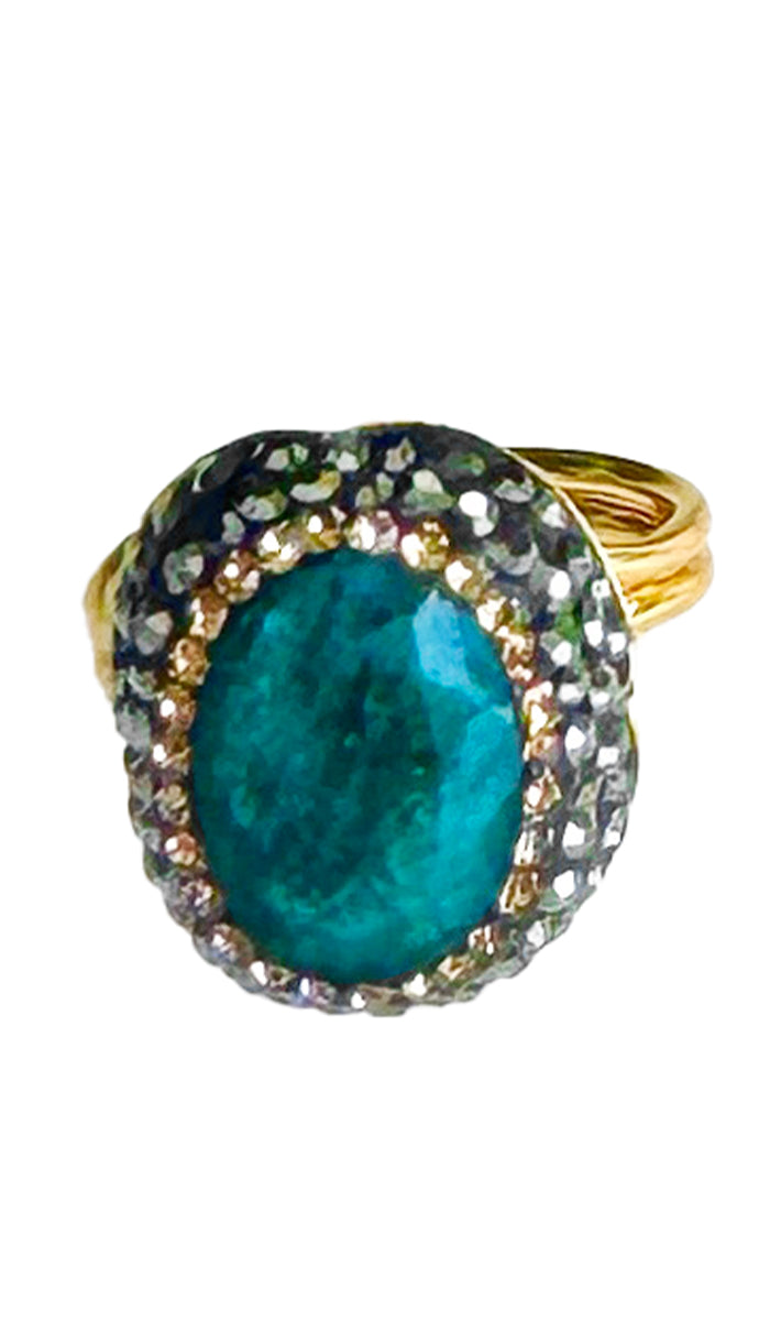 Front view of raw jade oval ring with gold and antique crystals.