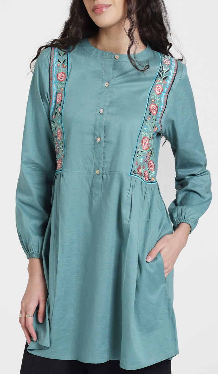 Woman wearing Marzo embroidered cotton modest tunic in Seagreen.