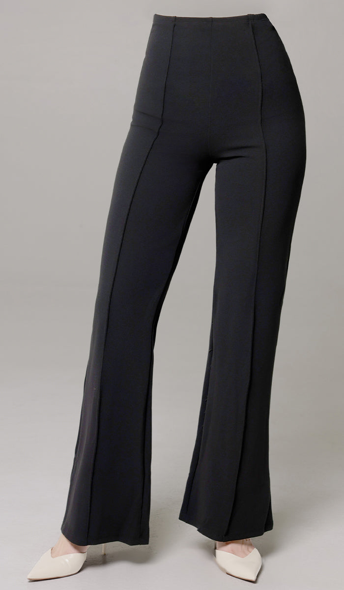 Woman wearing Riva flared pants in Black. 