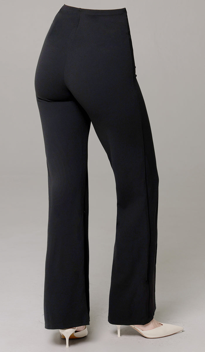 Back view of woman wearing Riva pants in Black. 