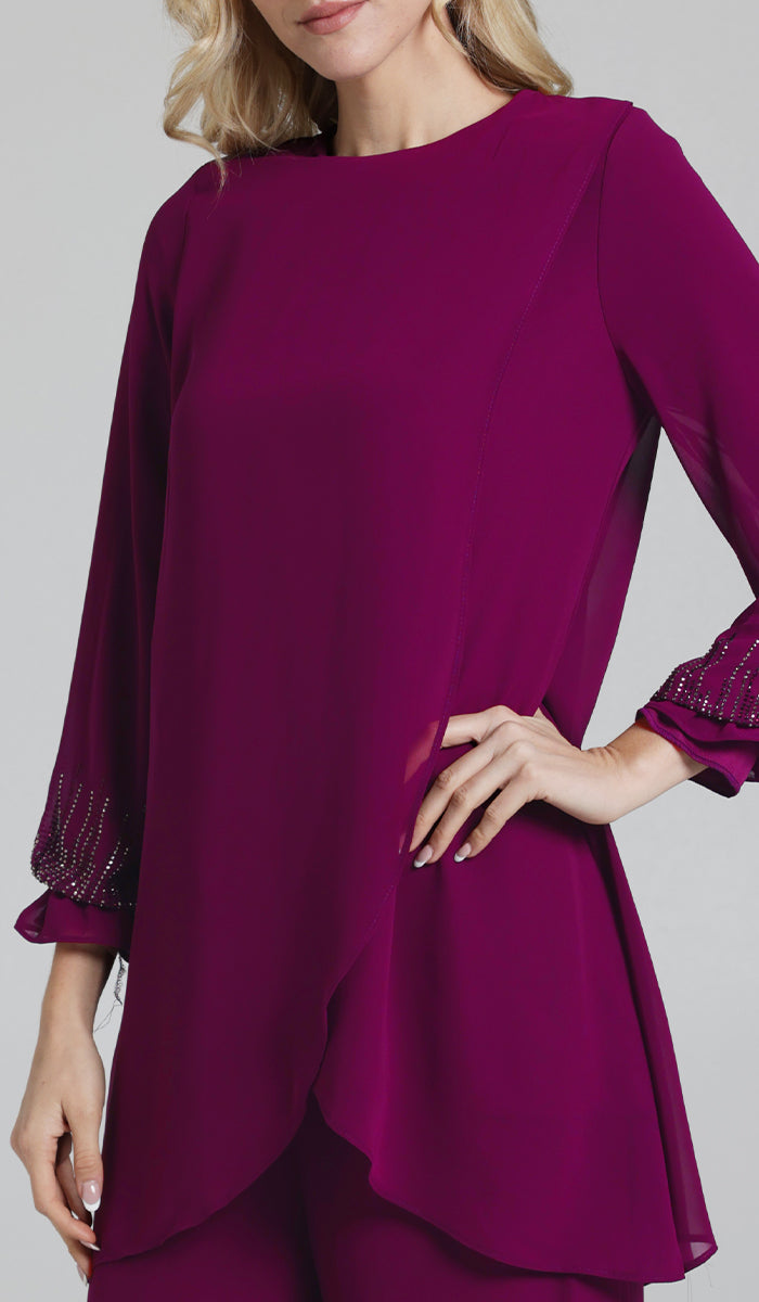 Woman wearing Seema tunic in Orchid. 