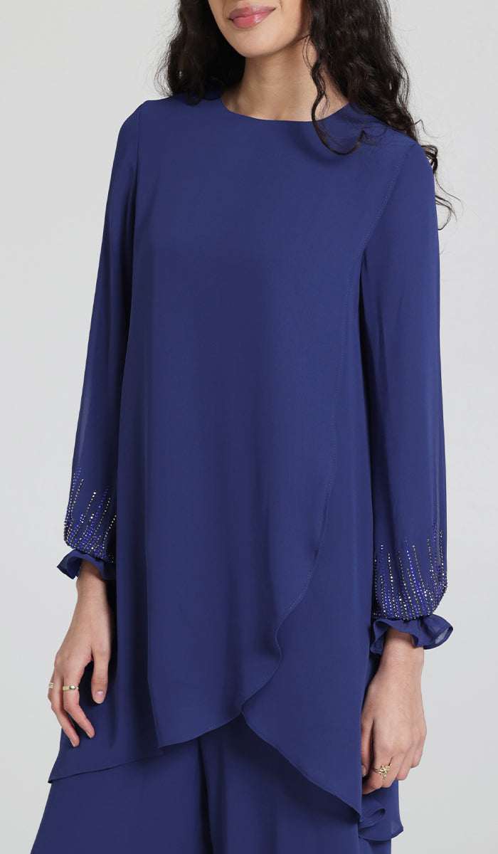 Woman smiling wearing Seema tunic in Blue. 