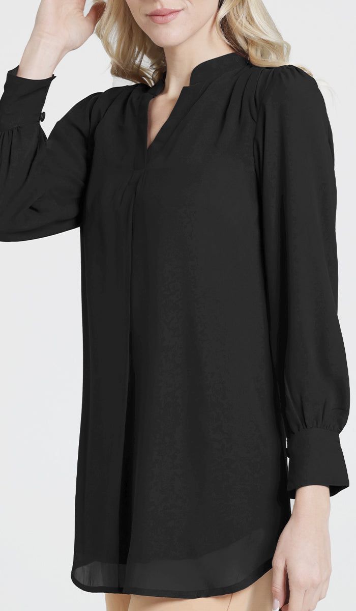 Woman wearing modest Shaina tunic in Black. 