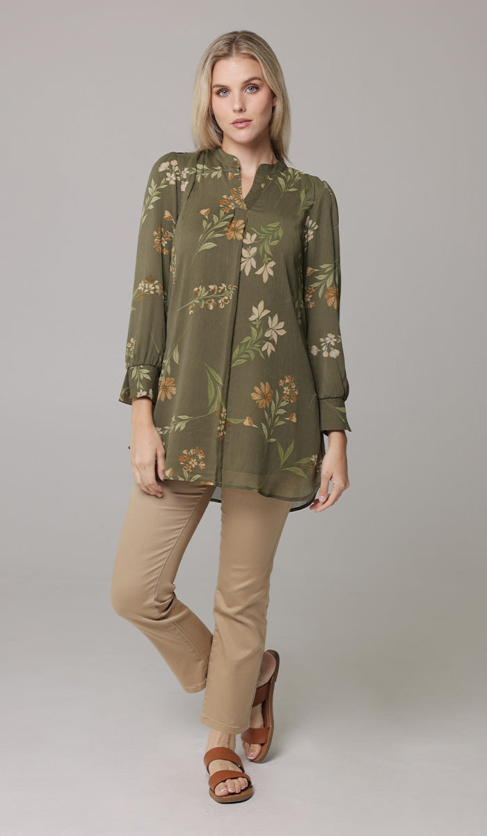 Woman wearing modest Shaina tunic in Olive with khaki pants and sandals. 