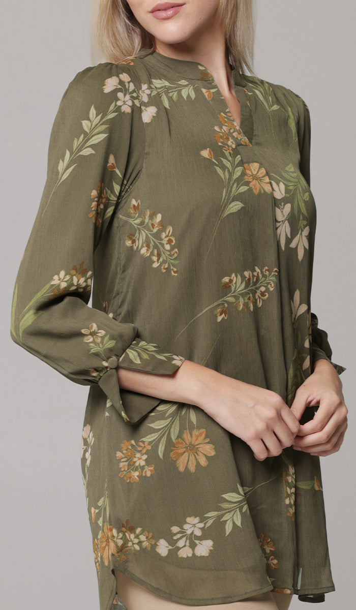 Blonde woman wearing modest Shaina printed tunic in Olive. 