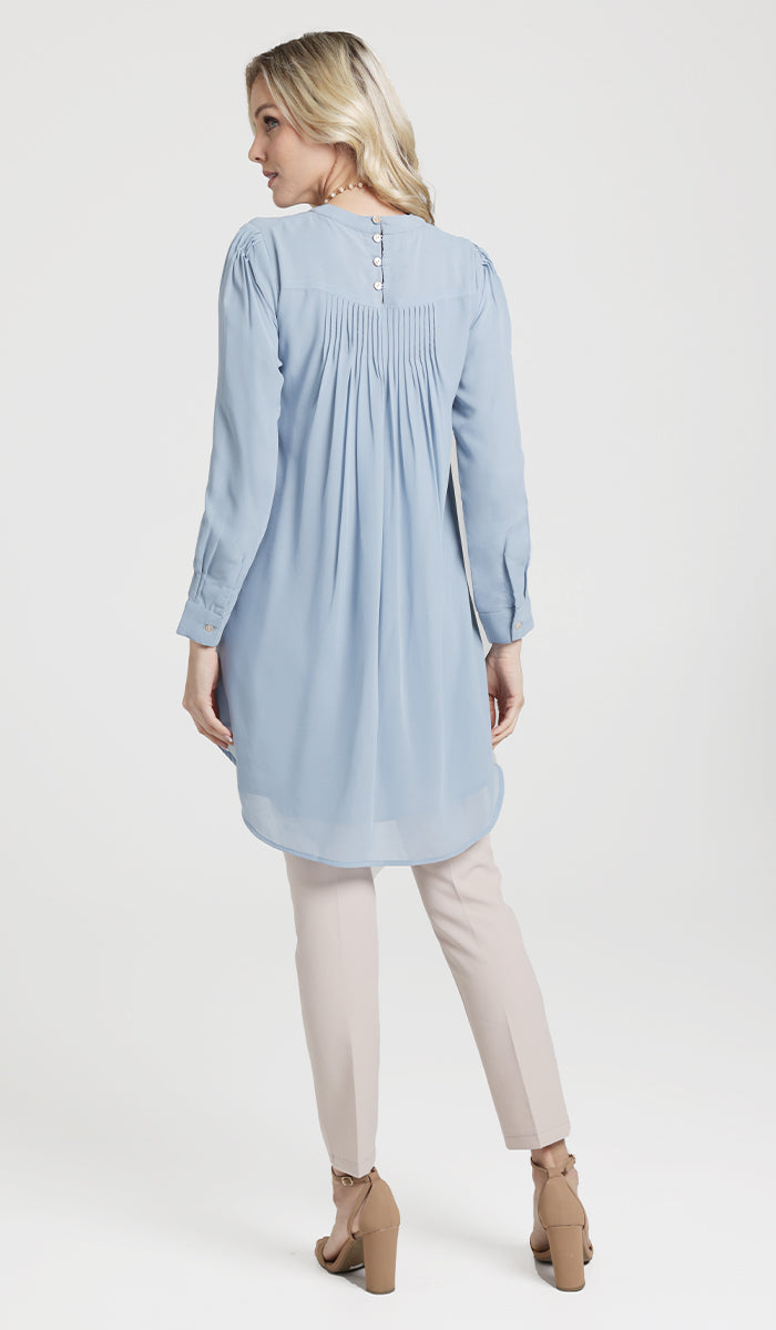 Back view of woman wearing Sukoon long flowy chiffon tunic dress in Powder Blue.