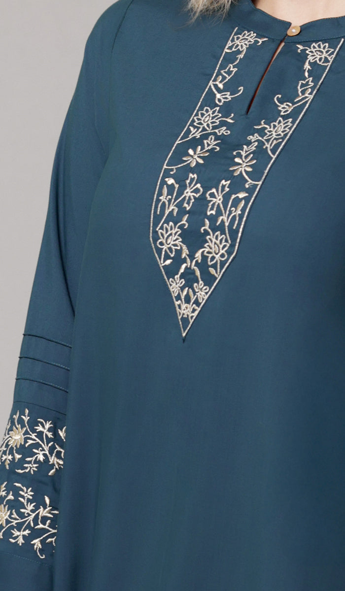 Embroidery details of Zoha tunic in Teal/Gold. 