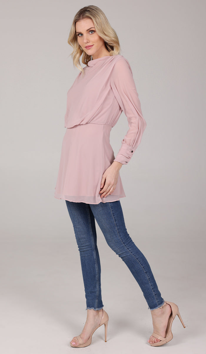 Side view of woman wearing Myra tunic in Tearose. 