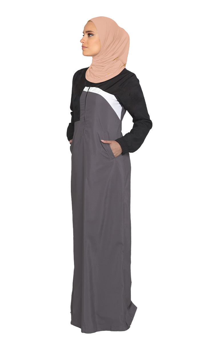 Woman wearing sports hijab in Blush with grey dress.