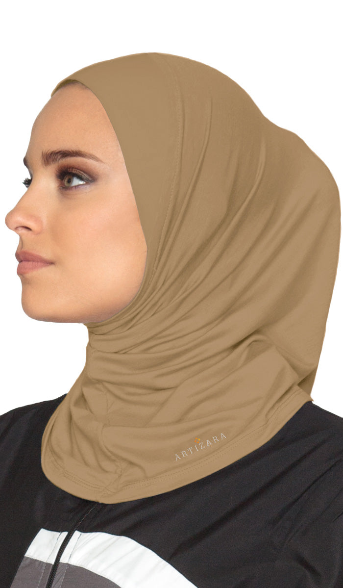 Side view of woman wearing one piece sports hijab in Cafe.