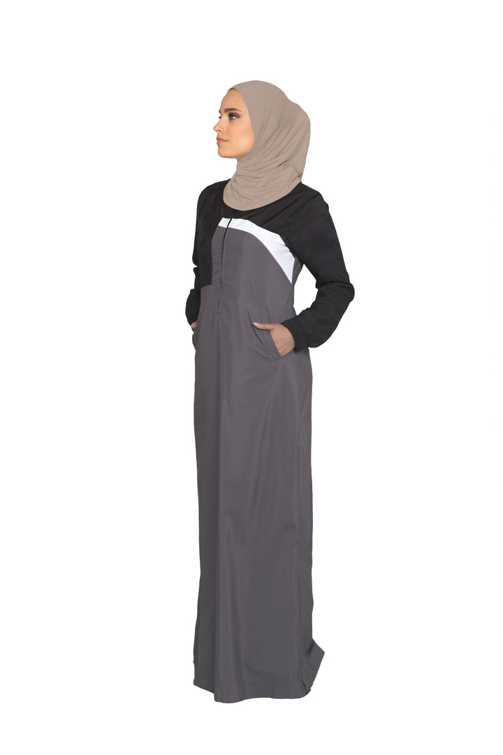 Full body view of woman wearing sports hijab in Mocha.