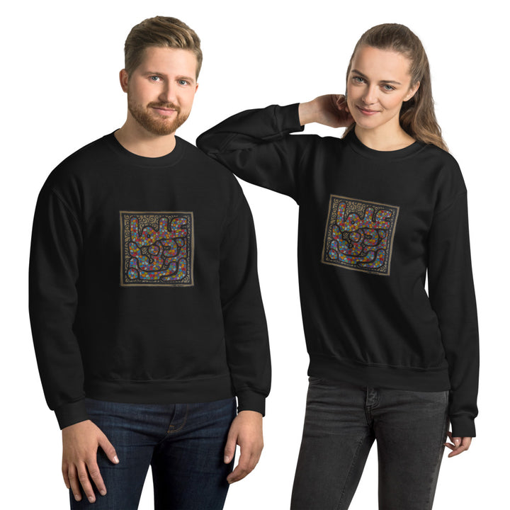 a man and woman wearing a black sweater with a square design.