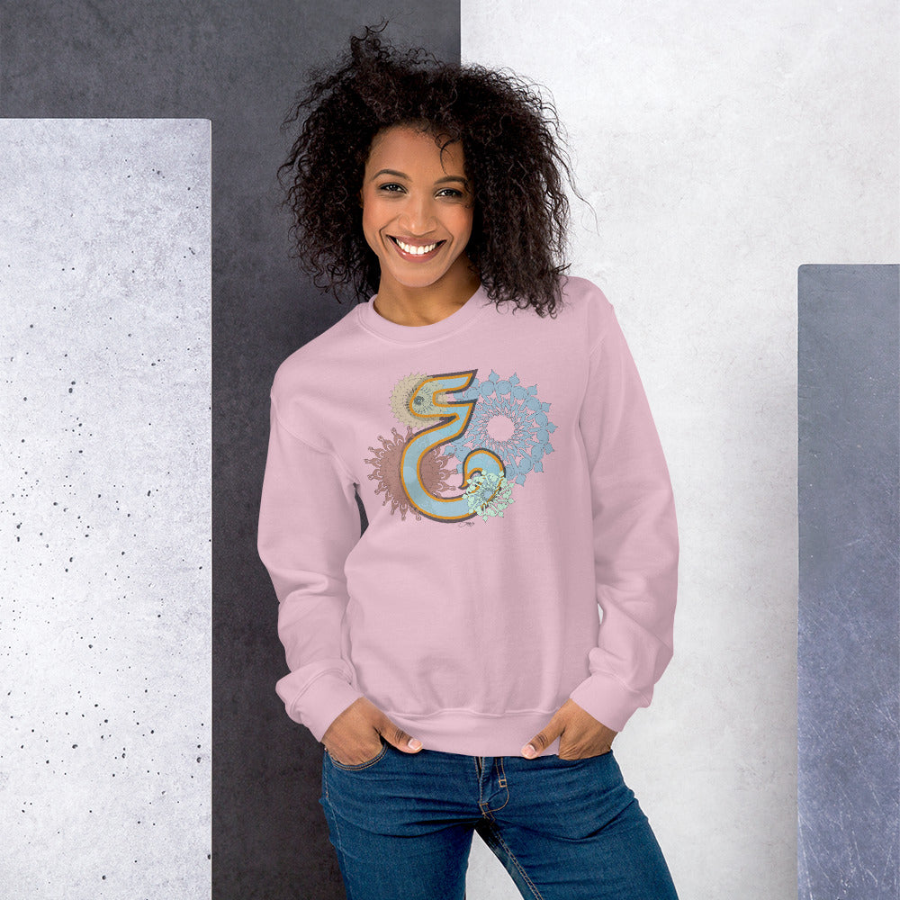 woman wearing a pink pullover sweater with design.